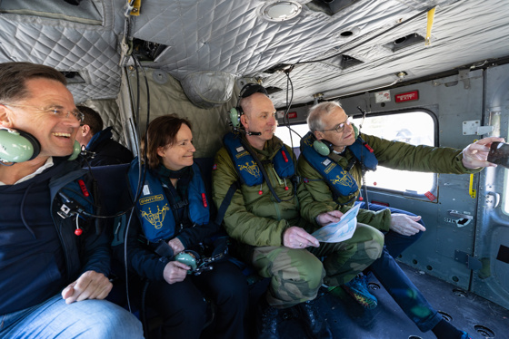 Inside a Bell-helicopter. NATO Secretary General and the Prime Minsiter aboard.