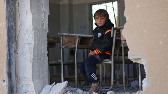 Ahmad, 6, sits in his damaged classroom at the education compound that was attacked in Has, rural Idleb, on 26 October 2016. “I wanted to become a doctor, but I don’t think this is possible anymore because the school was hit. I became afraid of coming here. My dad is saying he will move us to another school in a new village,” Ahmad says. ©UNICEF/2016/Syria/Idleb/Khalil Ashawi
